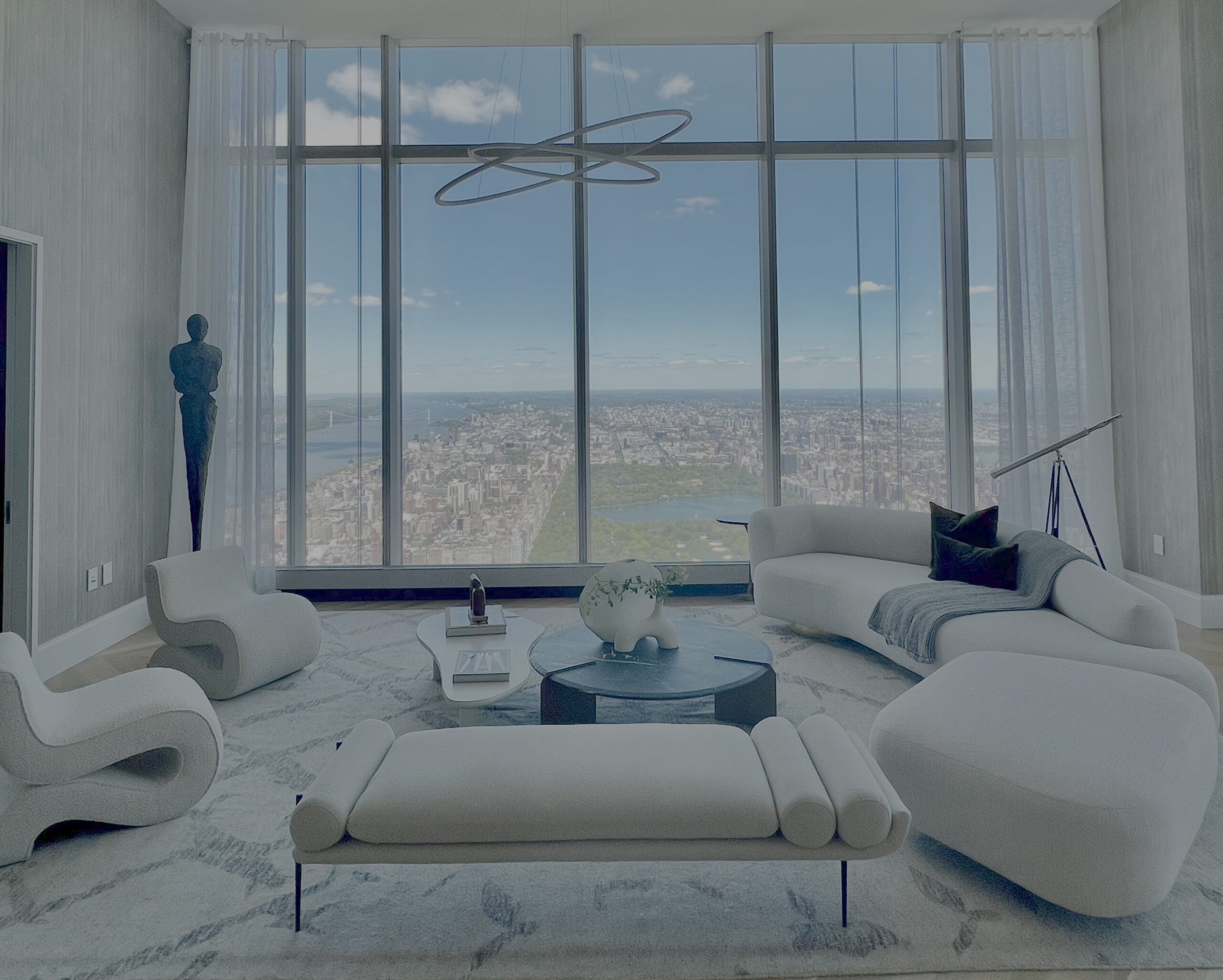 New York City apartment living room with floor-to-ceiling windows overlooking Central Park