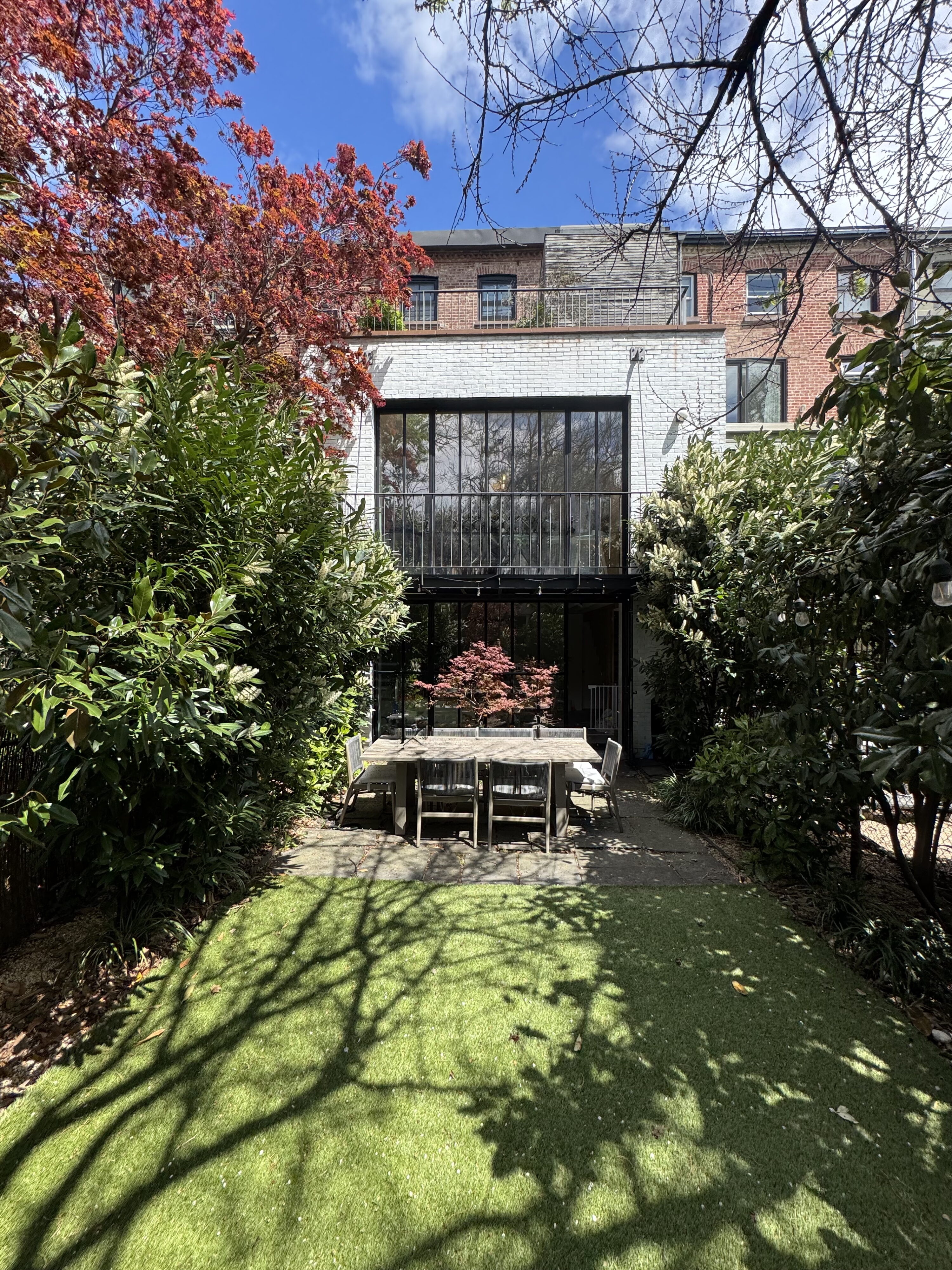 192 Warren Street backyard and view of back of the townhouse and extension